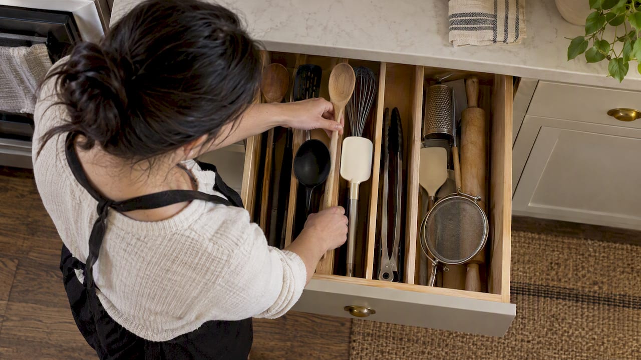 Tall kitchen utensils organized in a deep drawer