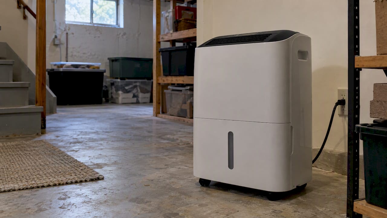 Portable dehumidifier running in a basement